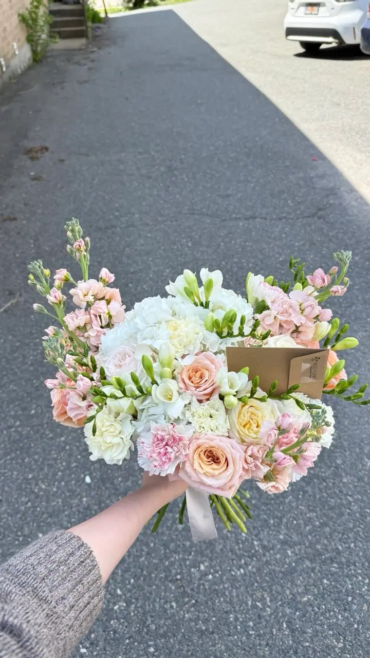 Hand-tied pastel rose and hydrangea bouquet by Wildflower Boston